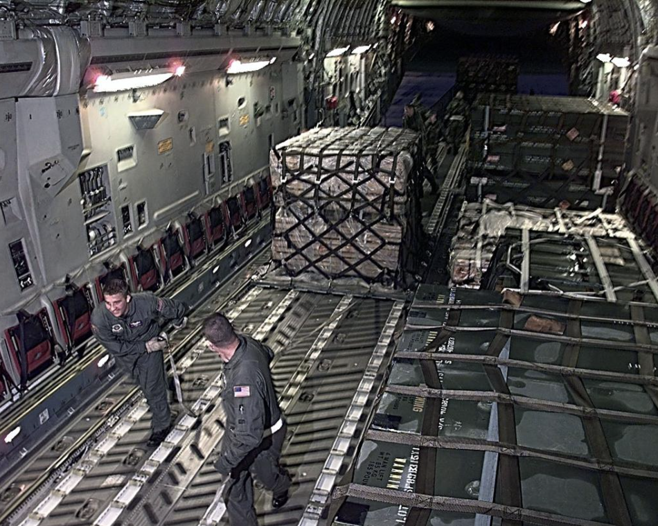 C-17 Loadmasters with cargo pallets